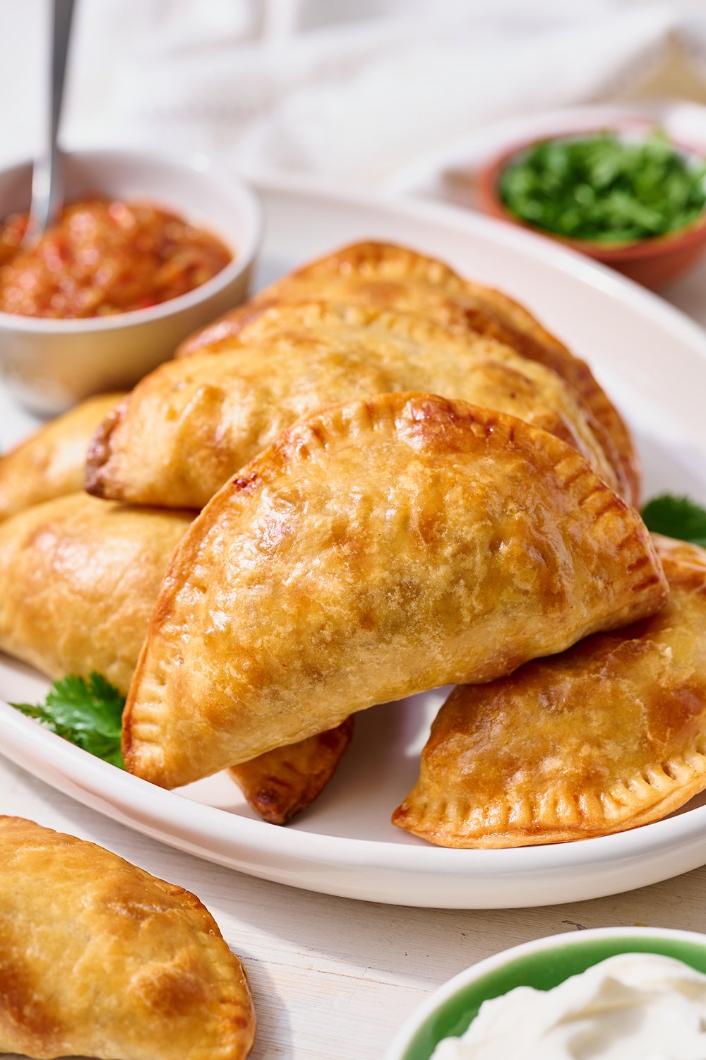 pile of empanadas on a plate