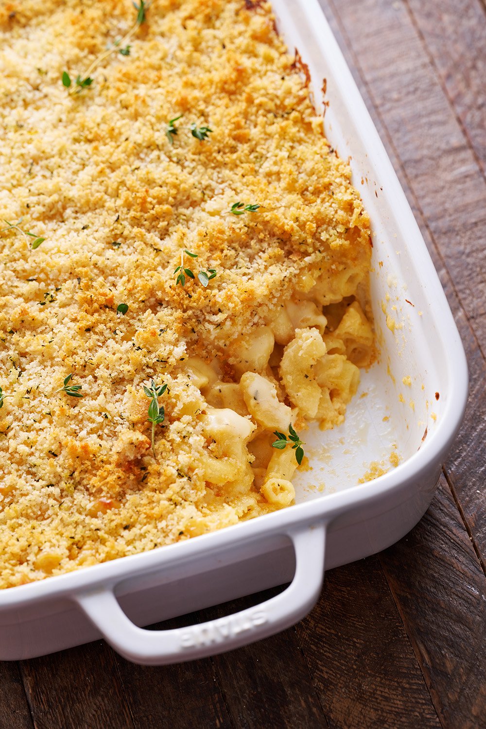 closeup of the pan of macaroni and cheese, with a spoonful taken out.