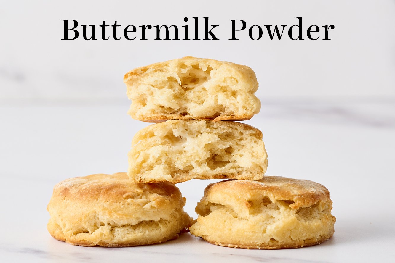 biscuits made with buttermilk powder in place of real buttermilk, with one torn open so you can see the insides of this biscuit