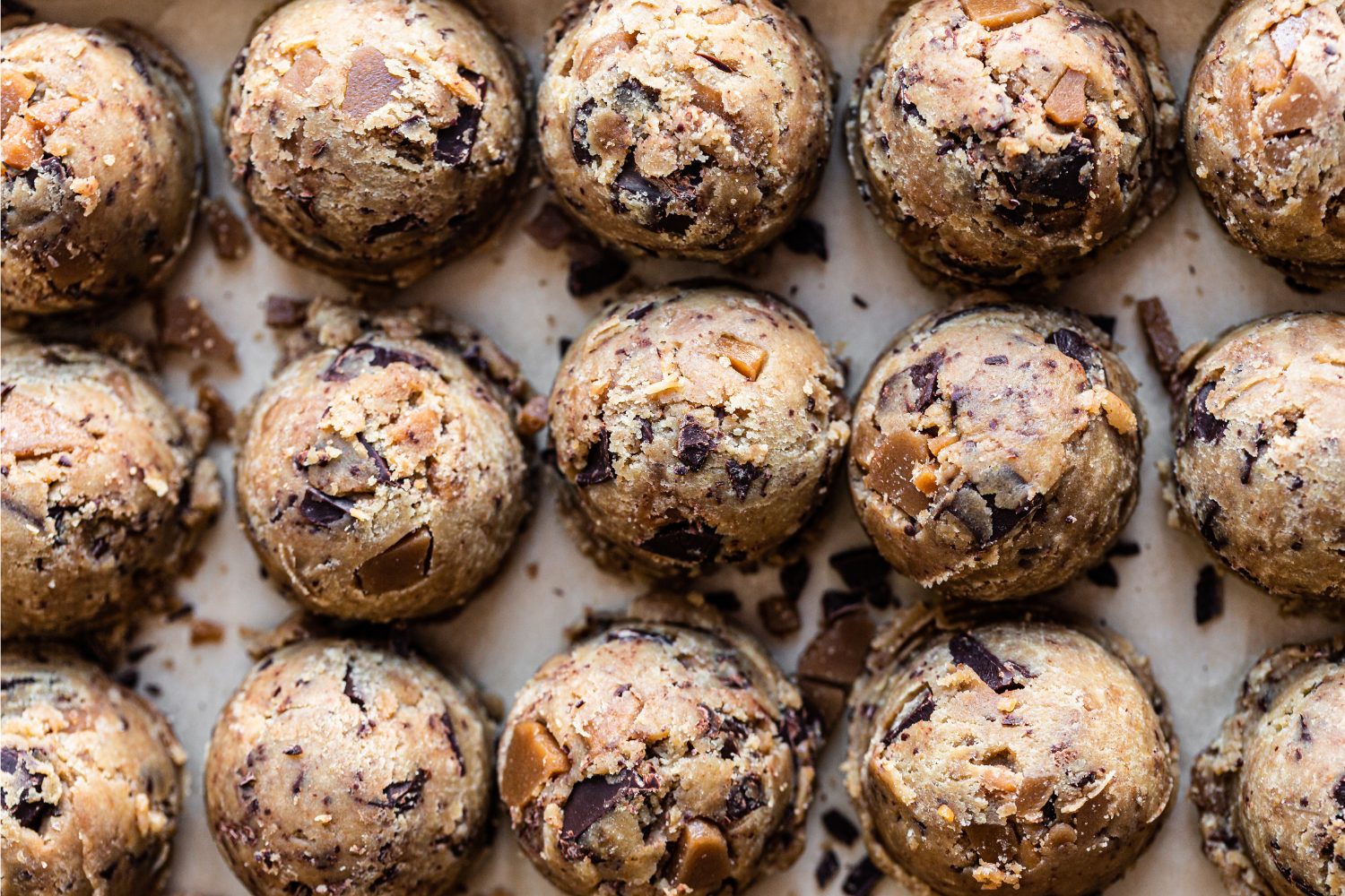 balls of Browned Butter Toffee Chocolate Chip Cookies ready to be moved to a baking tray and baked